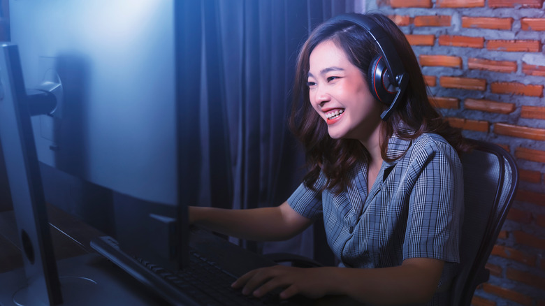 Woman wearing headset gaming