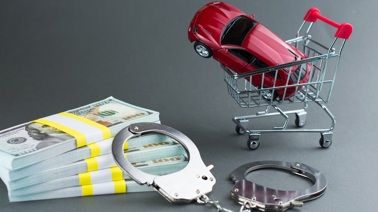 car in shopping cart cash handcuffs