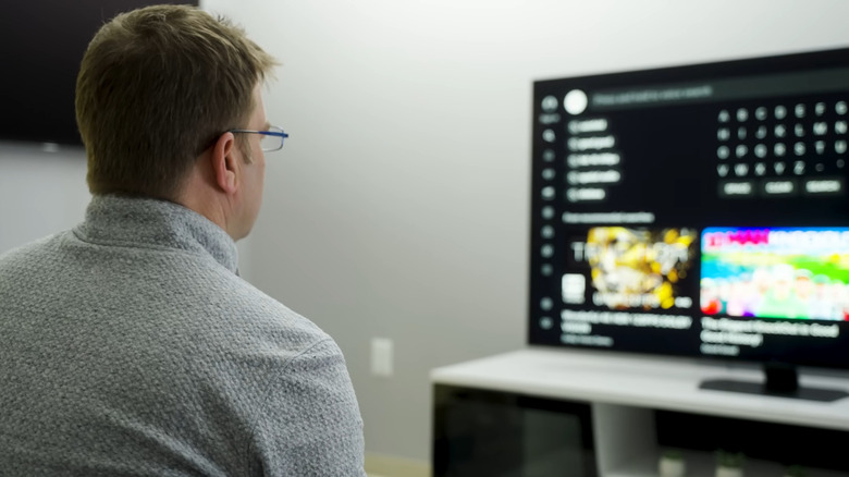 Man looking at his TV