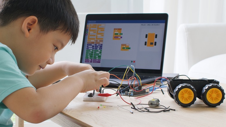 Child building Arduino project