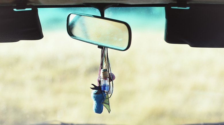 Objects hanging from rear-view mirror