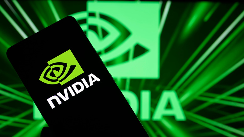 NVIDIA logo is being displayed on a smartphone and in the background