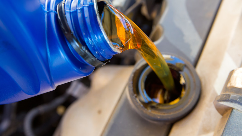 Pouring oil in container