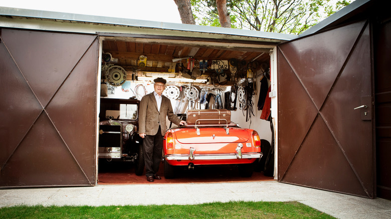 Driver in garage with car