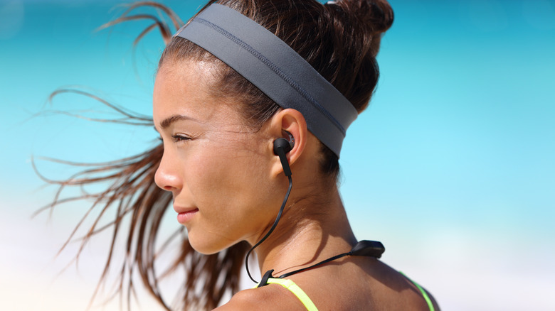 Wireless earphones woman athlete