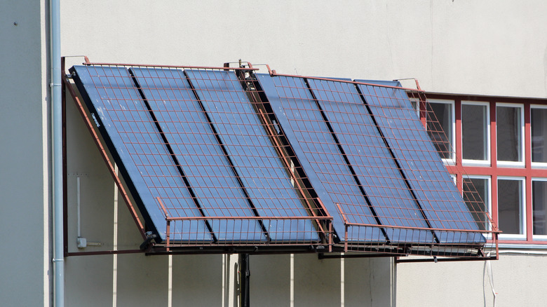 Solar panels being protecting by a crude wire mesh installation