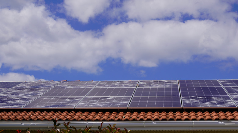 Hail-damaged solar panels on a roof