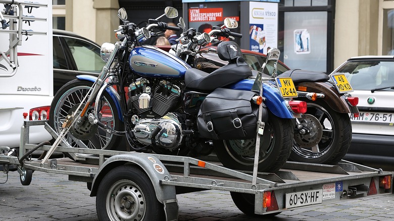 Two motorcycles on trailer behind RV