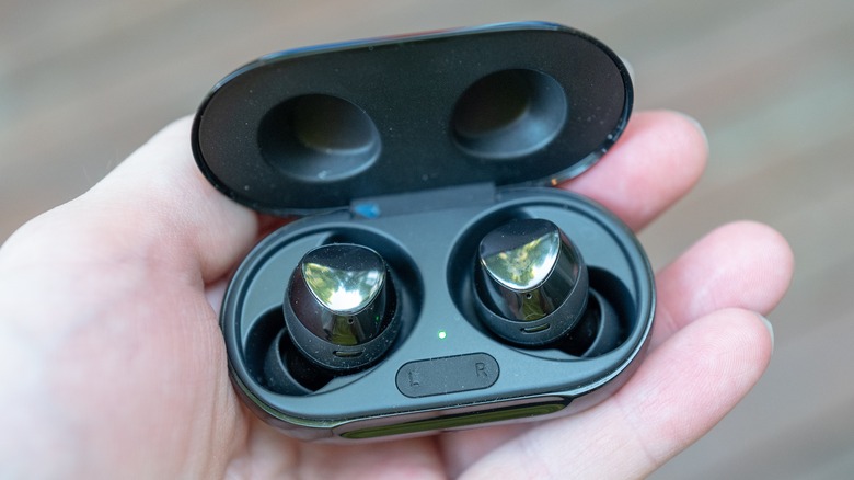 Person holding Samsung Galaxy Buds in case