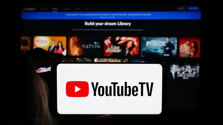 YouTube TV on phone display in front of TV app