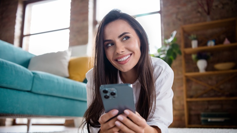 woman holding iPhone