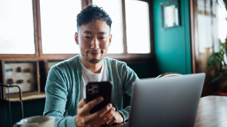 man holding iPhone