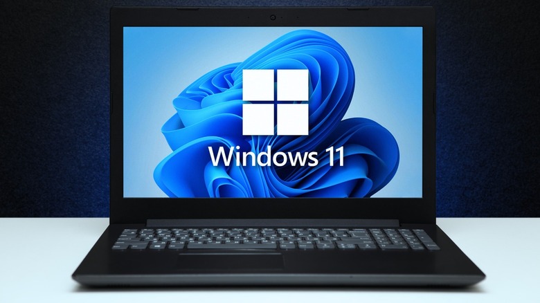 Laptop with a WIndows 11 logo and wallpaper