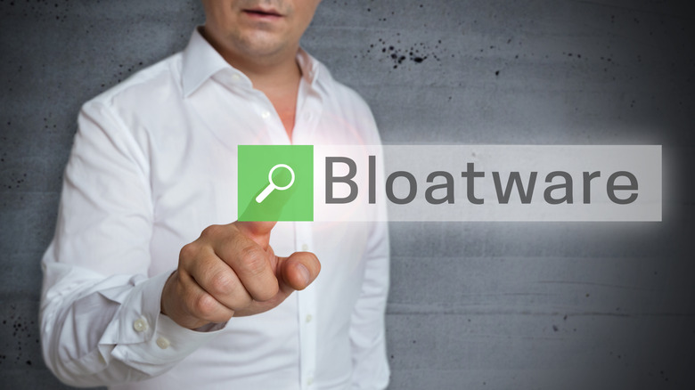 A man wearing white shirt searching for the term bloatware