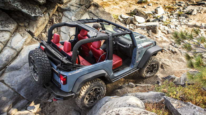 Jeep JK Wrangler Rubicon off-road with doors removed, rear-right view from above