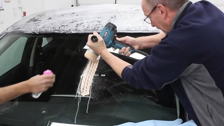 Man polishing on a windshield