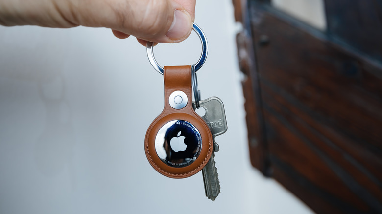 AirTag attached to a key in a keychain loop