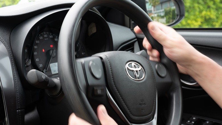 Man driving toyota car