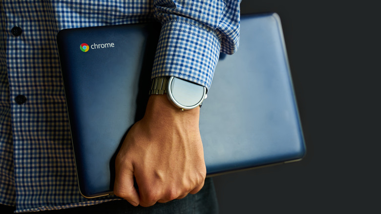 Man carrying Chromebook