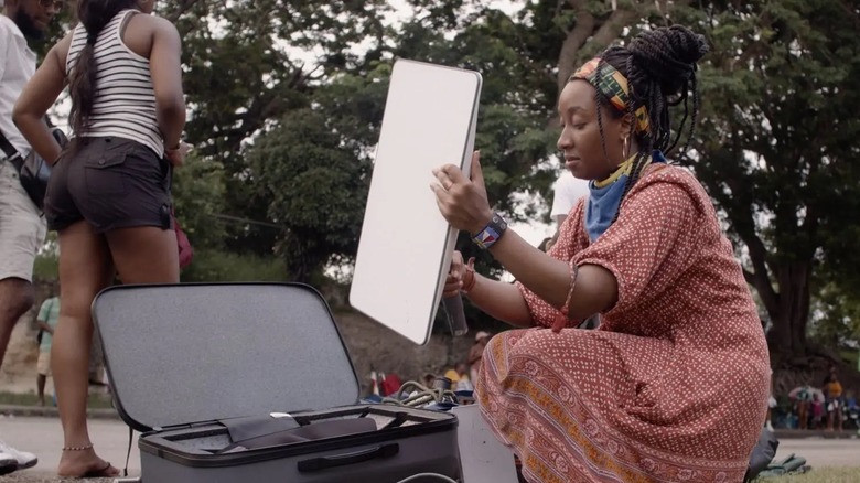 Woman holding a Starlink dish