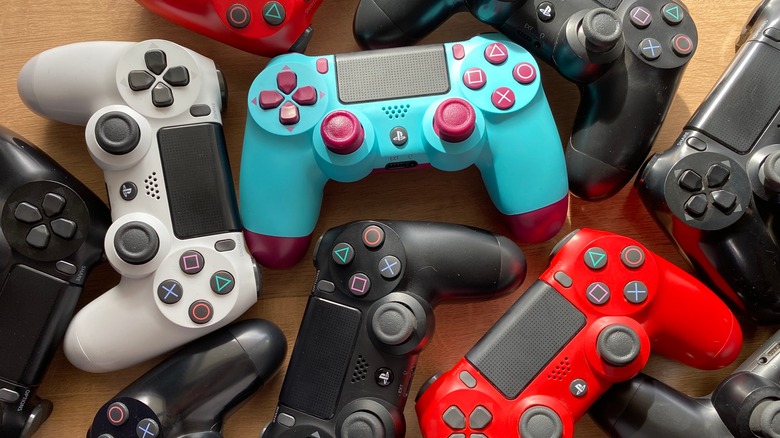 multiple PS4 controllers in various colors