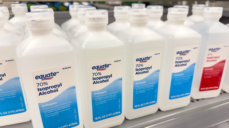 shelf full of isopropyl alcohol bottles