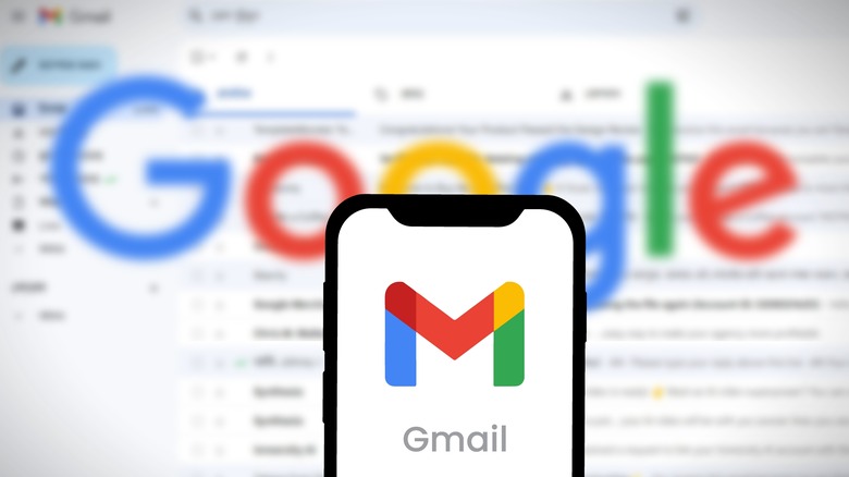 Phone showing Gmail icon with Google logo in the background