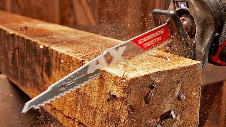 Ax Sawzall blade cutting through wood