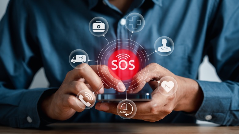 Man using phone with SOS emergency icons