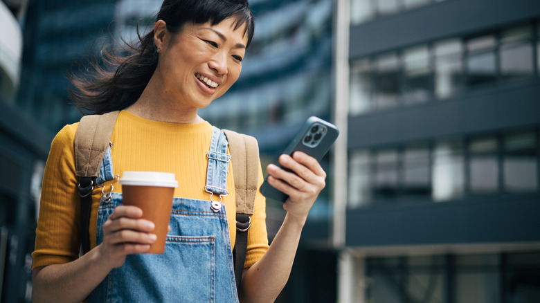 woman using iphone outdoors