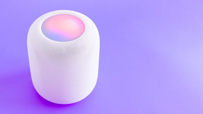 Apple HomePod on violet background