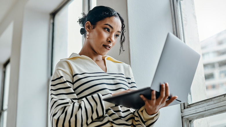 Woman reading on computer