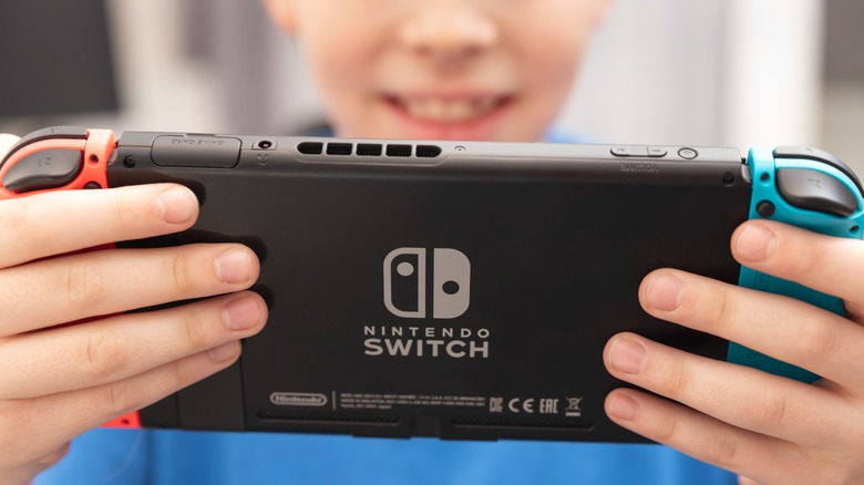 Boy plays on Nintendo Switch