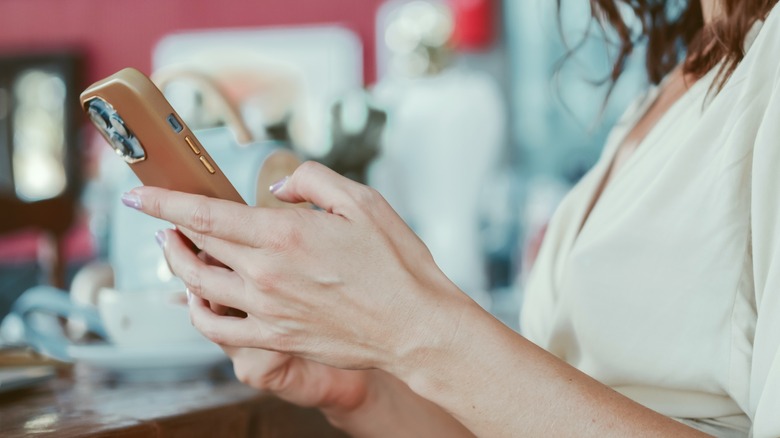 woman using iphone