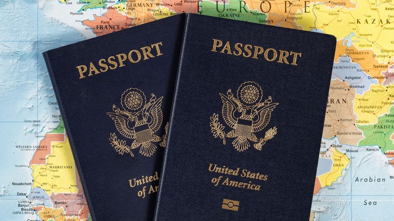 American Passports over World Map Atlas