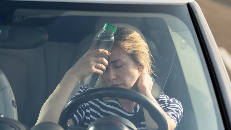 Woman inside a hot car with no A/C