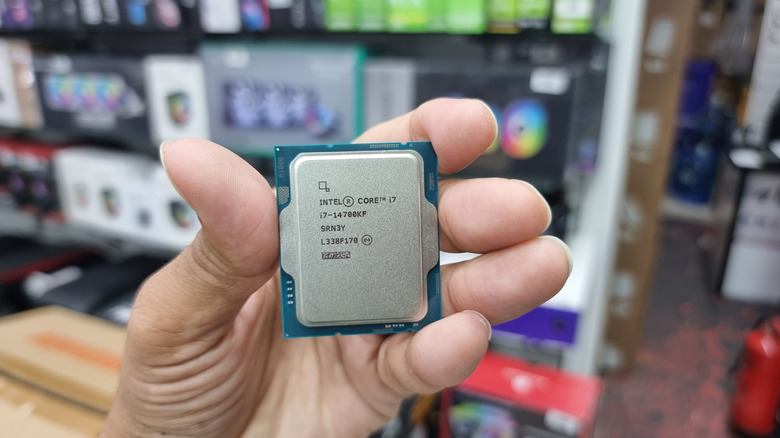 Hand holding Intel Core i7 CPU