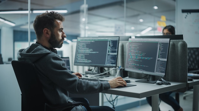 Man using computer terminal