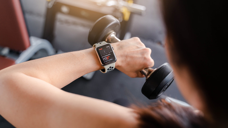 woman checking heart rate Apple Watch