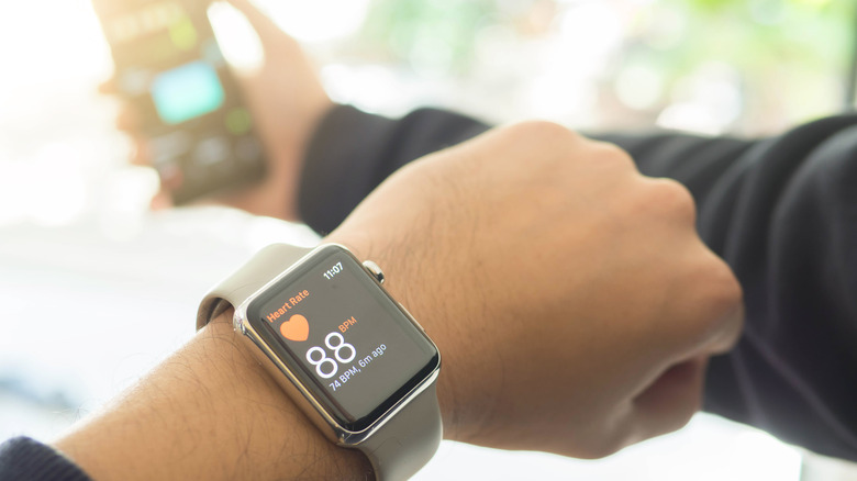 man monitoring heart rate Apple Watch