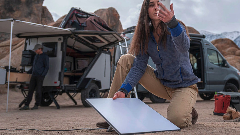 Woman setting up Starlink