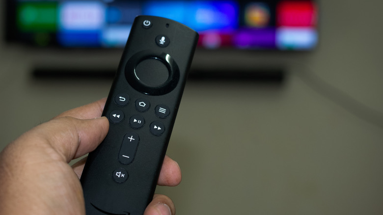 Amazon Fire TV remote in hand