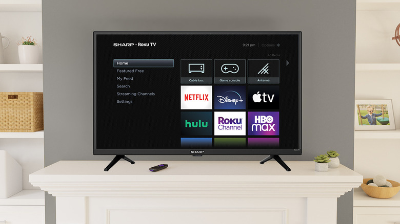 Roku home screen on a Sharp TV in a living room