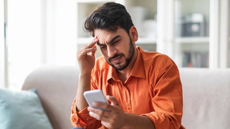 man looking at phone 