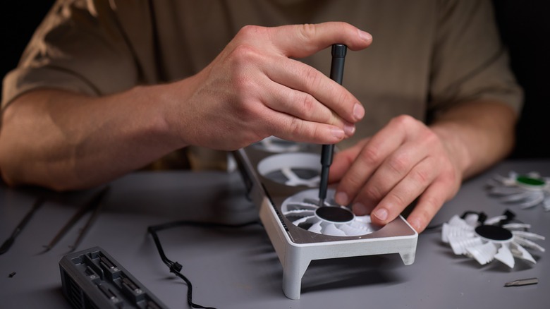 Man fixing graphics card