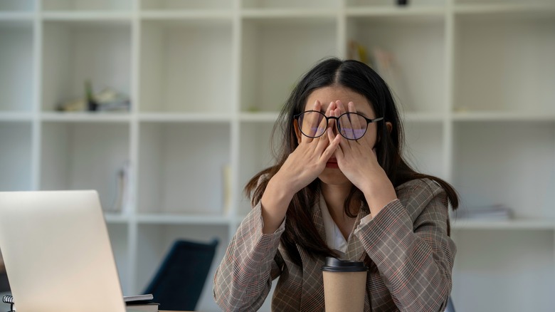 person frustrated at desk