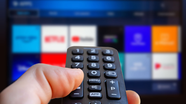 Remote in front of blurred TV