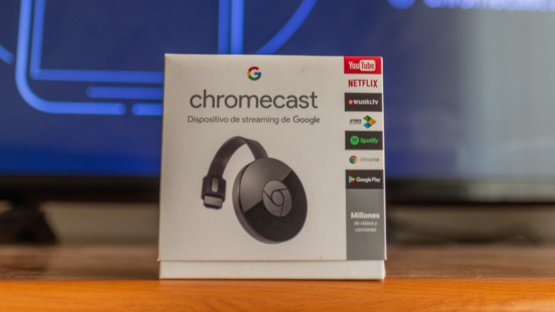 Second generation Chromecast in box in front of TV