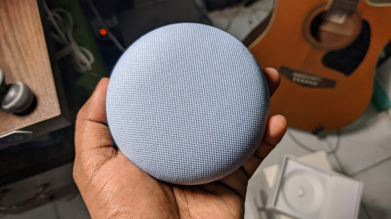 Nest Mini speaker in hand