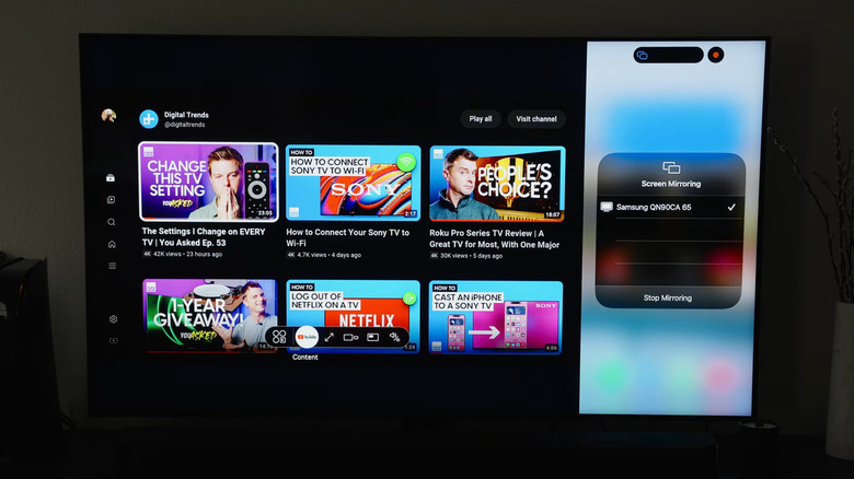 iPhone screen mirrored next to YouTube on Samsung Smart TV